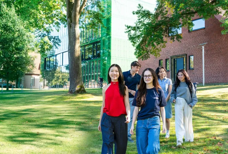 Diverse group of Constructor students walking behind the IRC