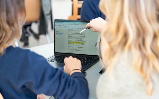 Students working on a laptop at Constructor University