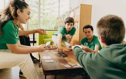 Students playing cards at College 3
