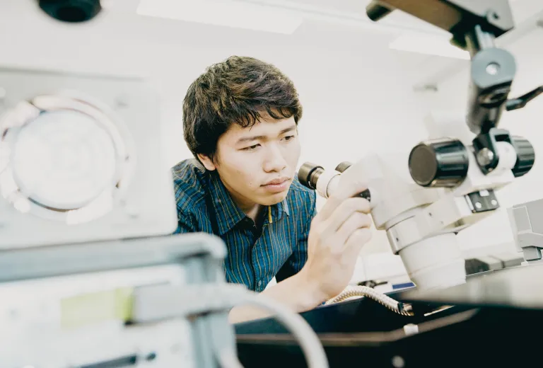 Student with a microscope