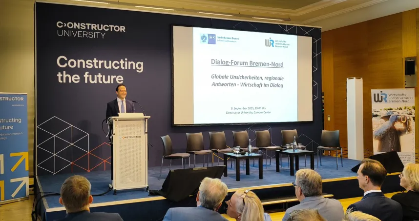 Constructor University Chancellor Turgut Tülü speaking at the event.