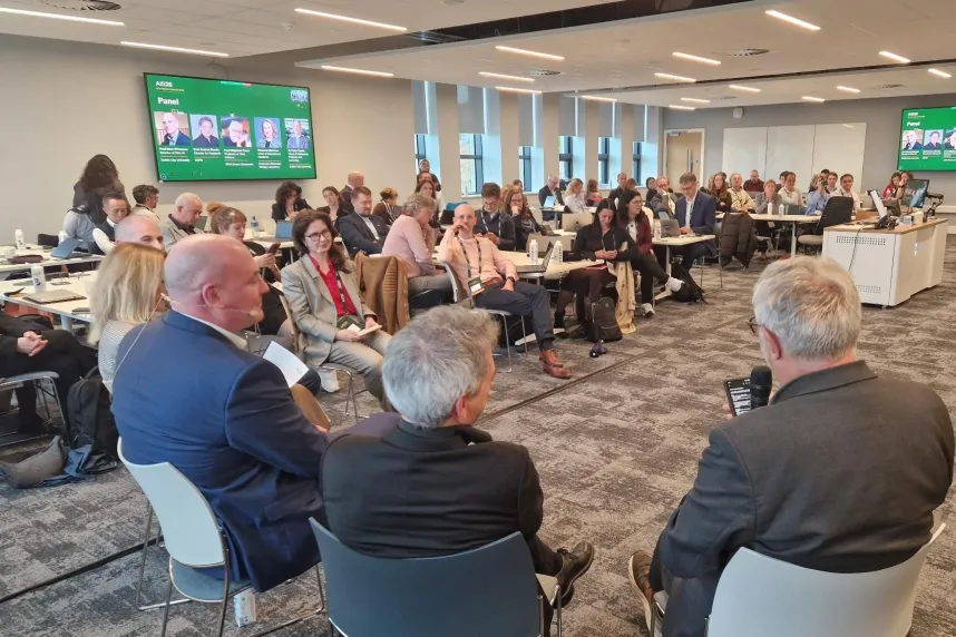 Dr. Mariia Snigireva, Executive Director of Constructor Knowledge Labs, moderates a panel discussion related to RAISE at AIS26 in Dublin.
