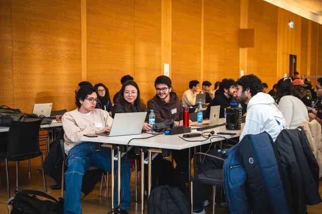Students working at laptops