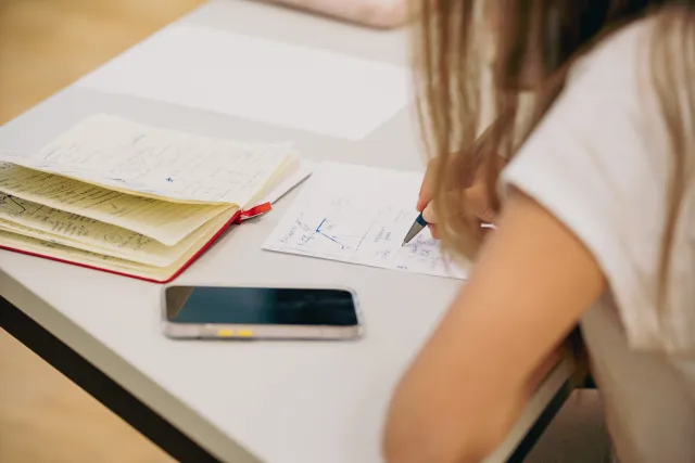 A student working on a notepad