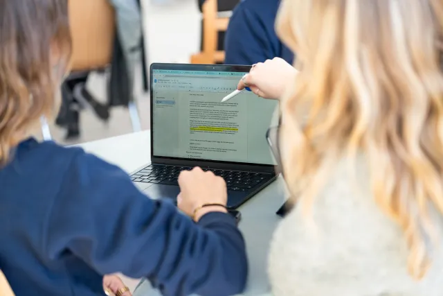 Students working on a laptop at Constructor University