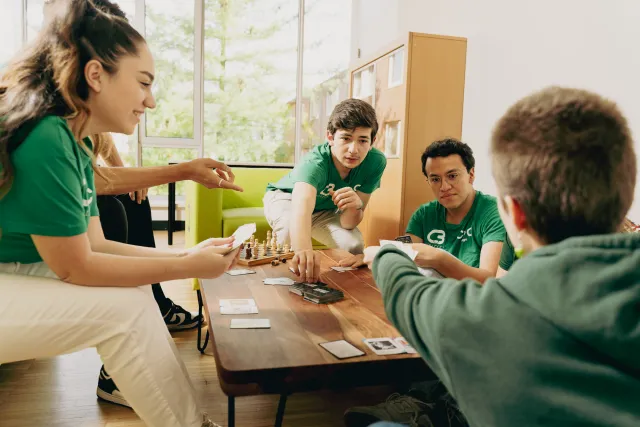 Students playing cards at College 3