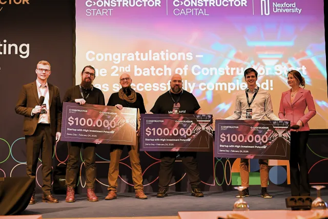Three winning startups pose with their checks for $100,000 at Constructor University's last Demo Day finale in February 2026.