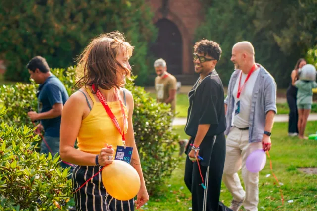 Alumni enjoying an outdoor gathering on the Constructor University campus